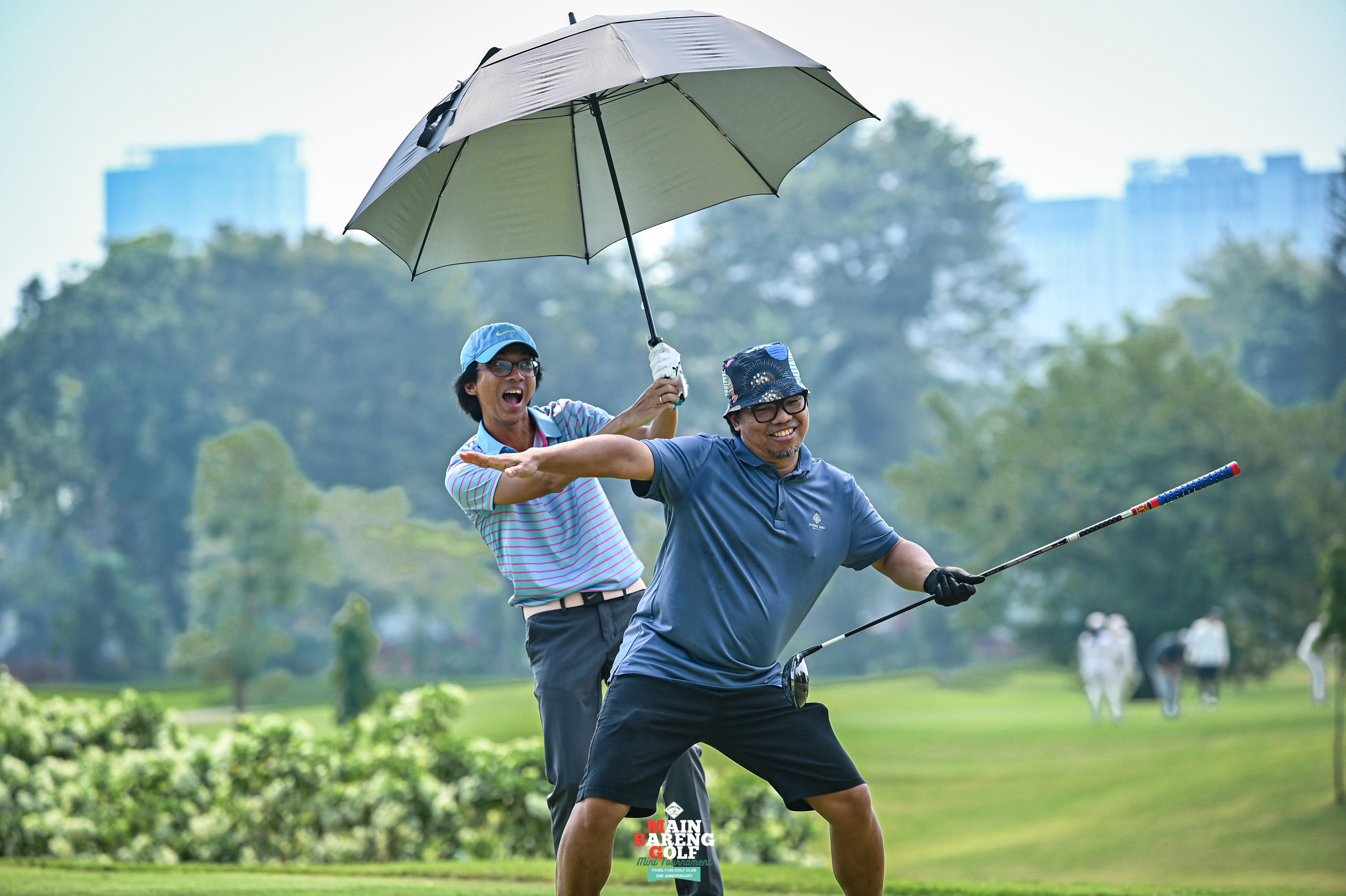 Two Family 100 Golf Club golfers having fun together on the course